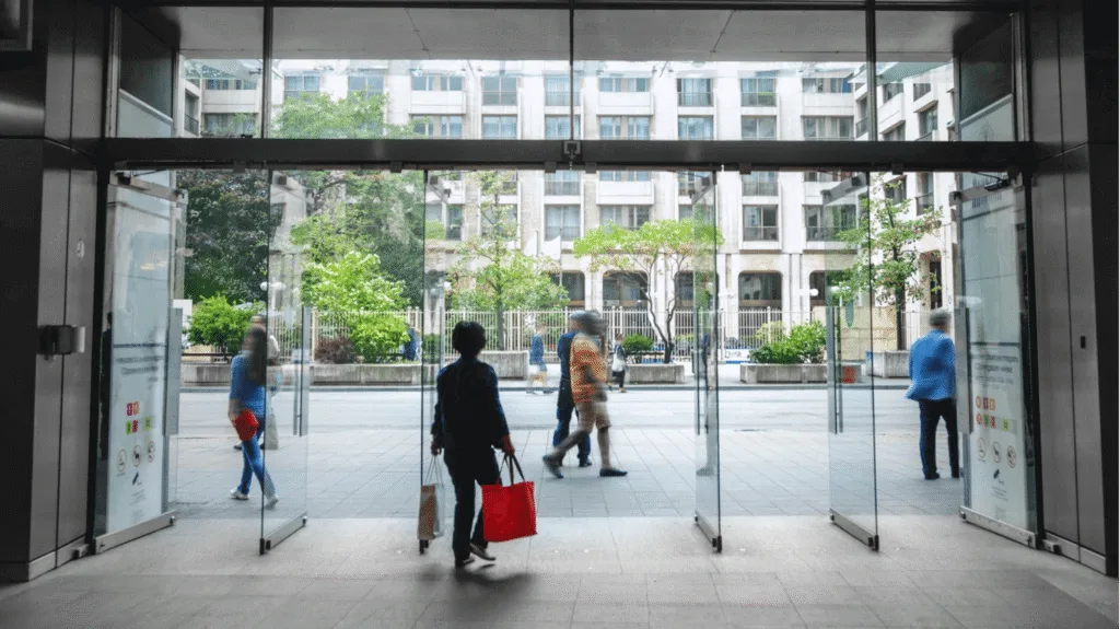 Shoppers at the entrance to a shopping centre
