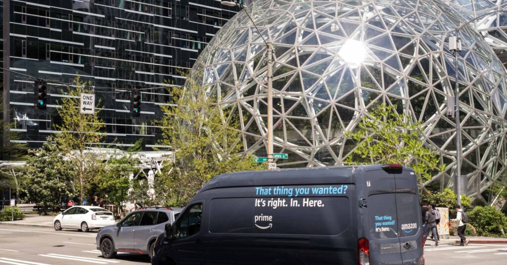 Late in the day an Amazon prime delivery truck passing by the Amazon HQ.