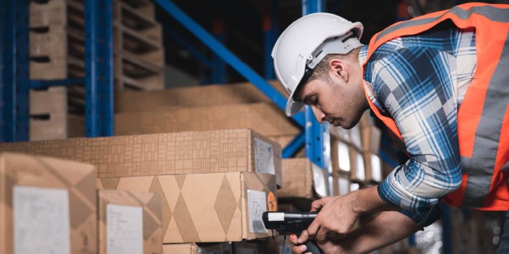 factory worker scanning a qr code