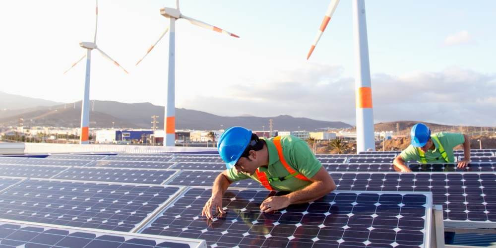 maintenance workers fixing solar panels