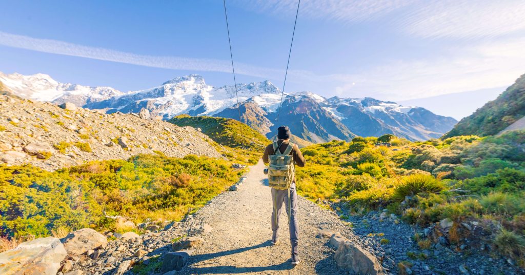 mountaineer setting off on hike in mountains