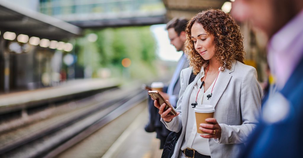 woman shopping on social media during morning commute