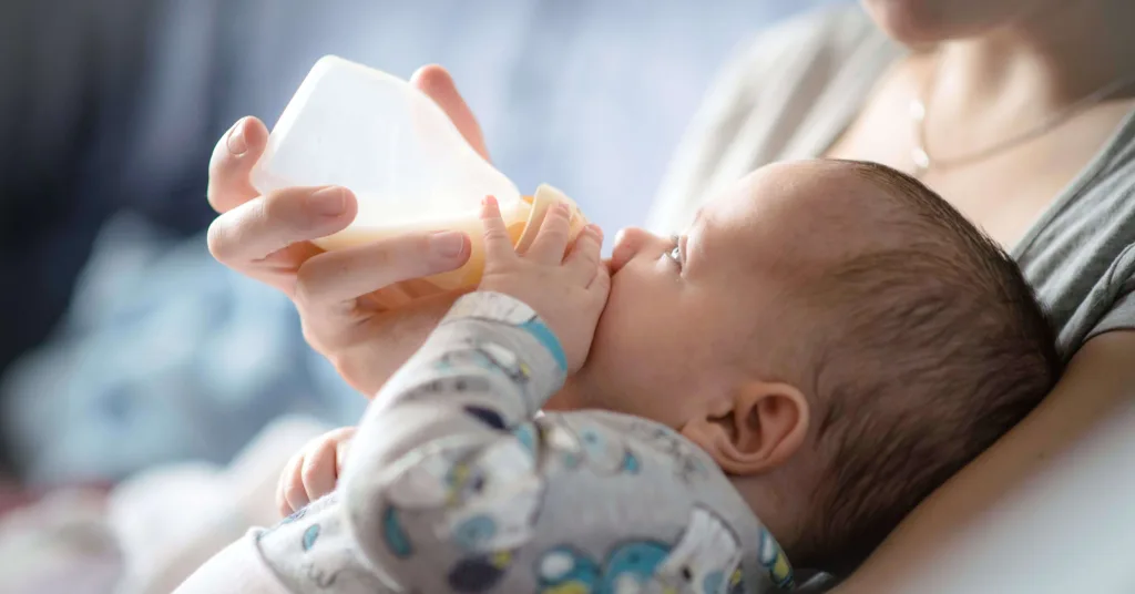 A baby feeding from a bottle