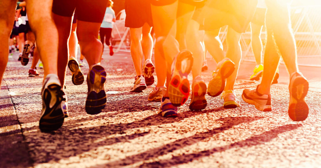 shot of runners' feet during road race