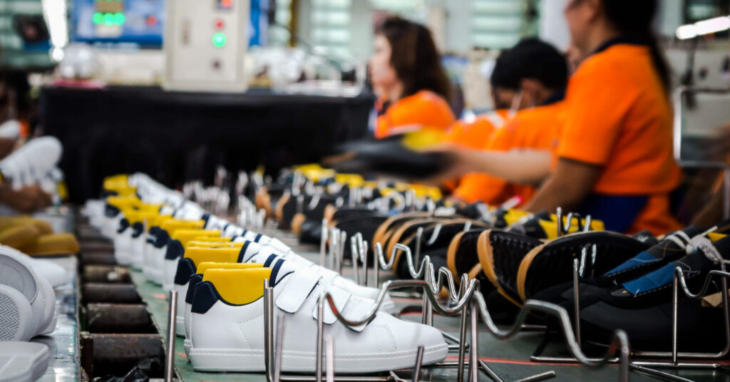 factory workers on sneaker production line