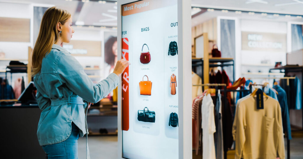 female shopper using digital product catalog in fashion store