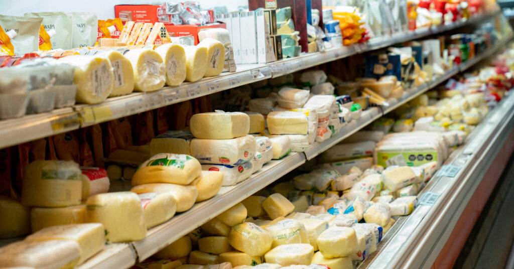 cheese shelf in supermarket