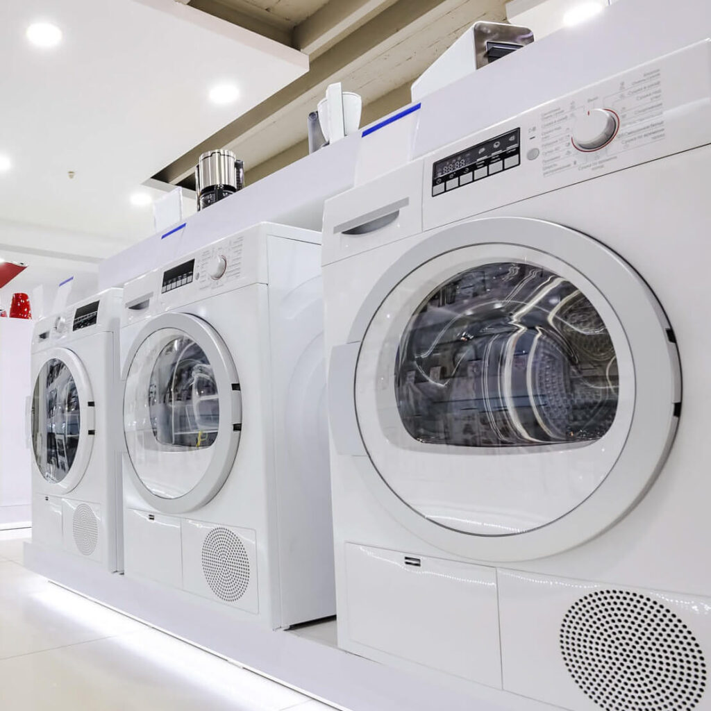 showroom of home electronics brand, showing washing machines in a row