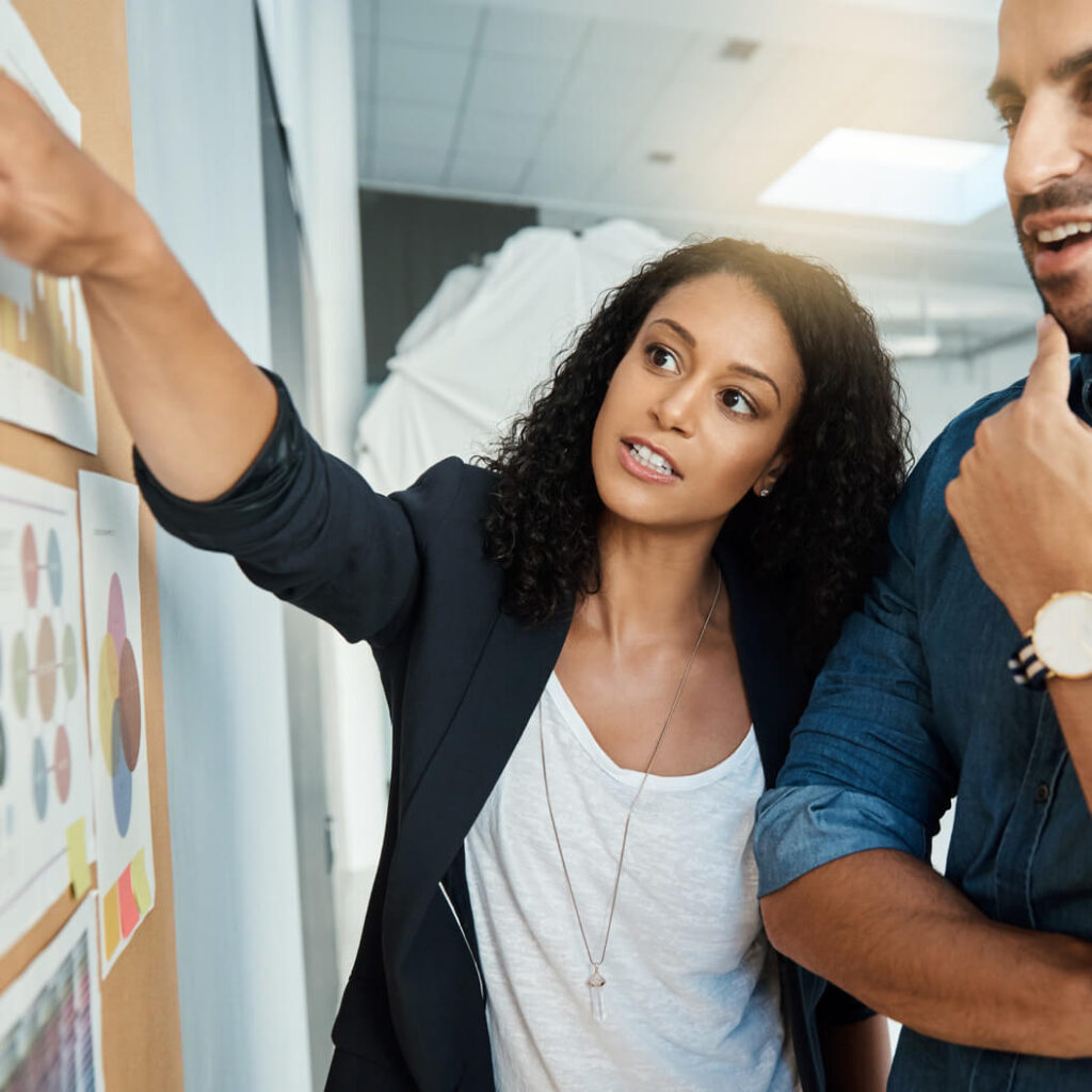 marketing team working together on white board