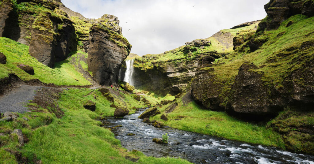 green landscape with waterfalls