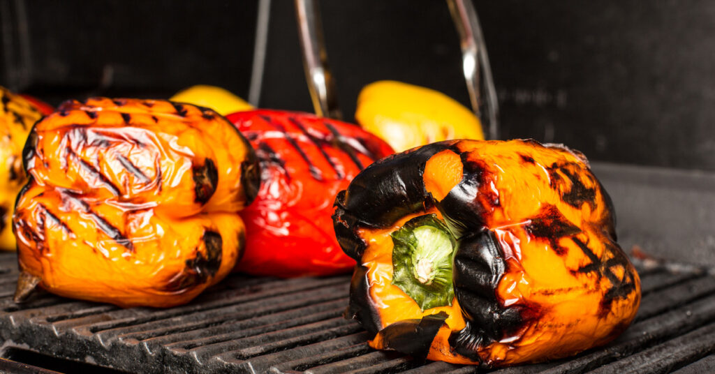 chargrilled bell peppers on barbecue