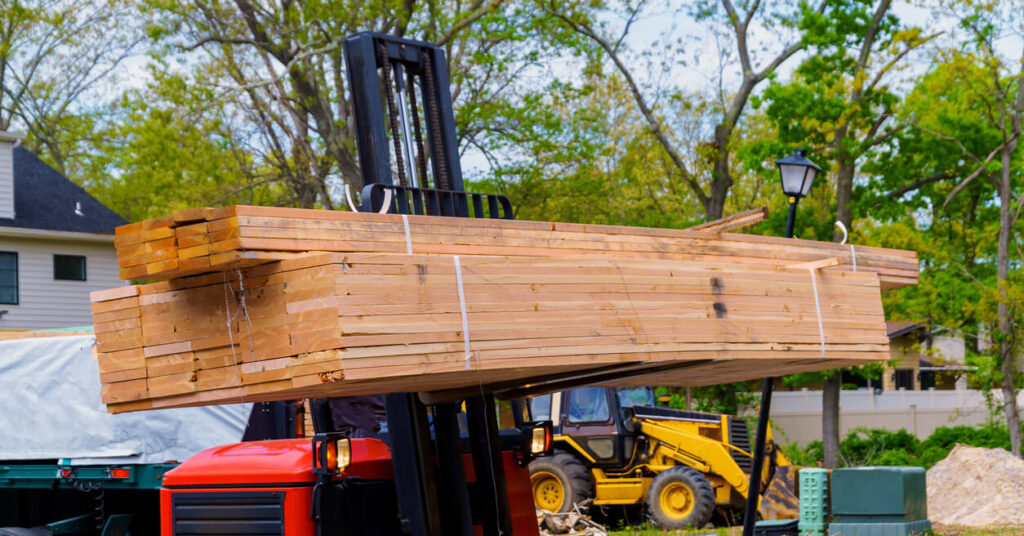 cut and finished wooden planks at construction site