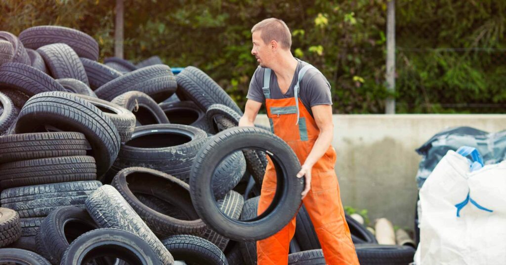 operative working at tire recycling plant