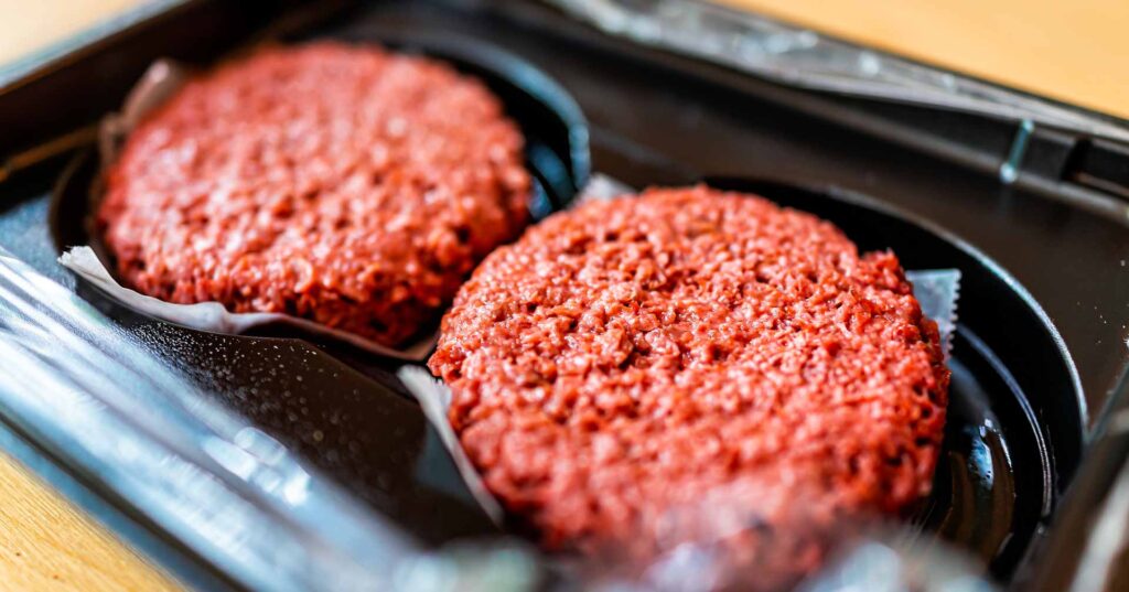 close up of two vegan meat patties