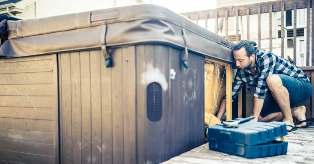 Man repairing a hot tub