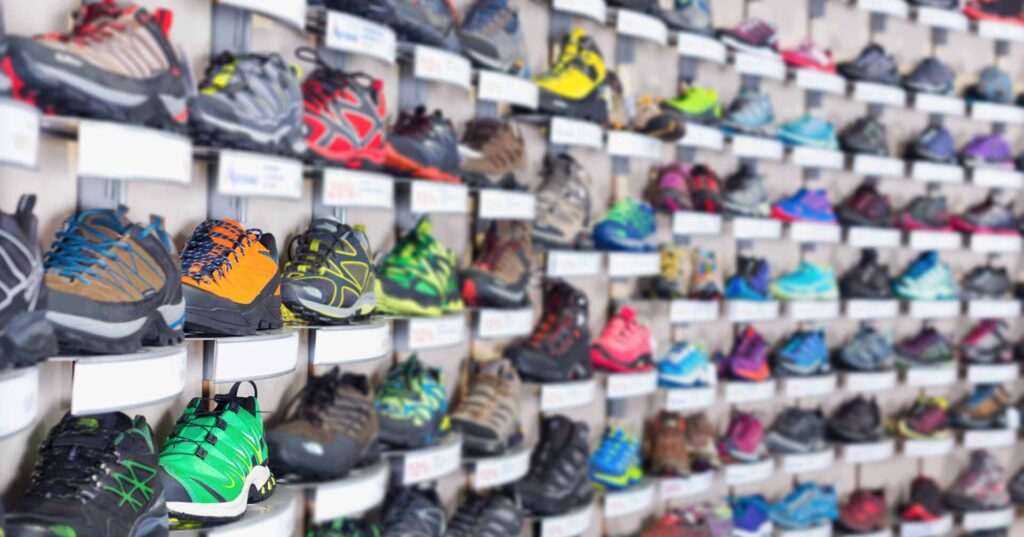 Image of sport colorful shoes on showcase of sports shop