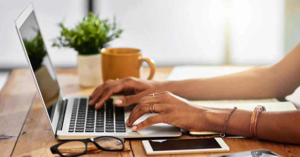 Shot of an unrecognizable woman working from home