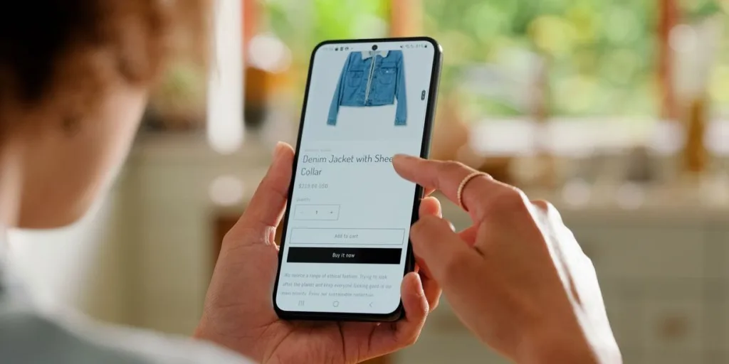 scrolling smartphone shopping fashionable jacket