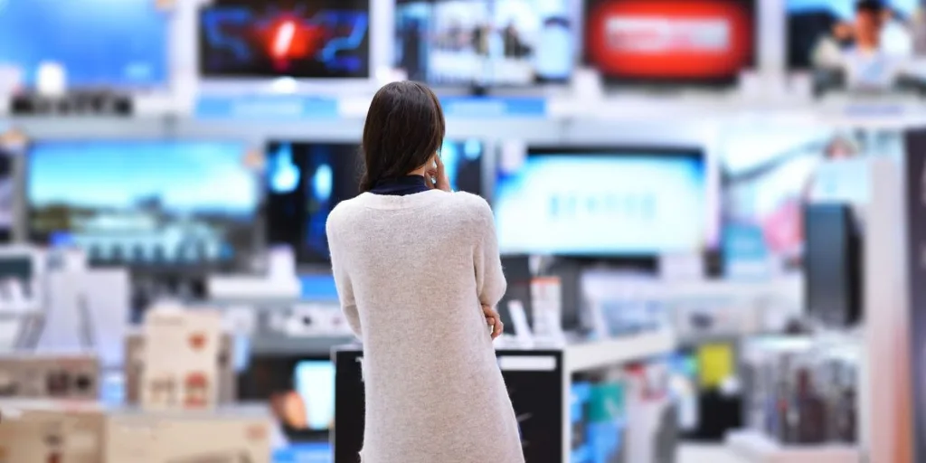 woman looking at tv wall