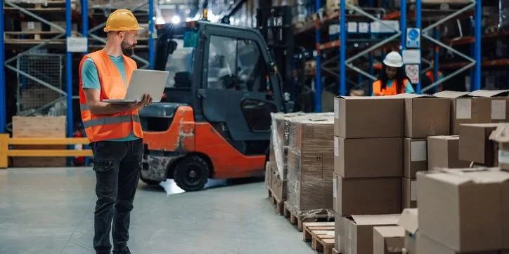 workers handling multiple products in warehouse