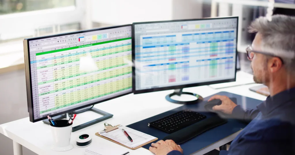 man working on spreadsheets in the office