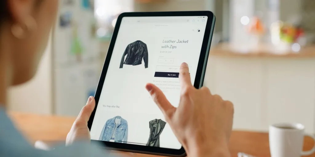 woman shopping for black jacket online